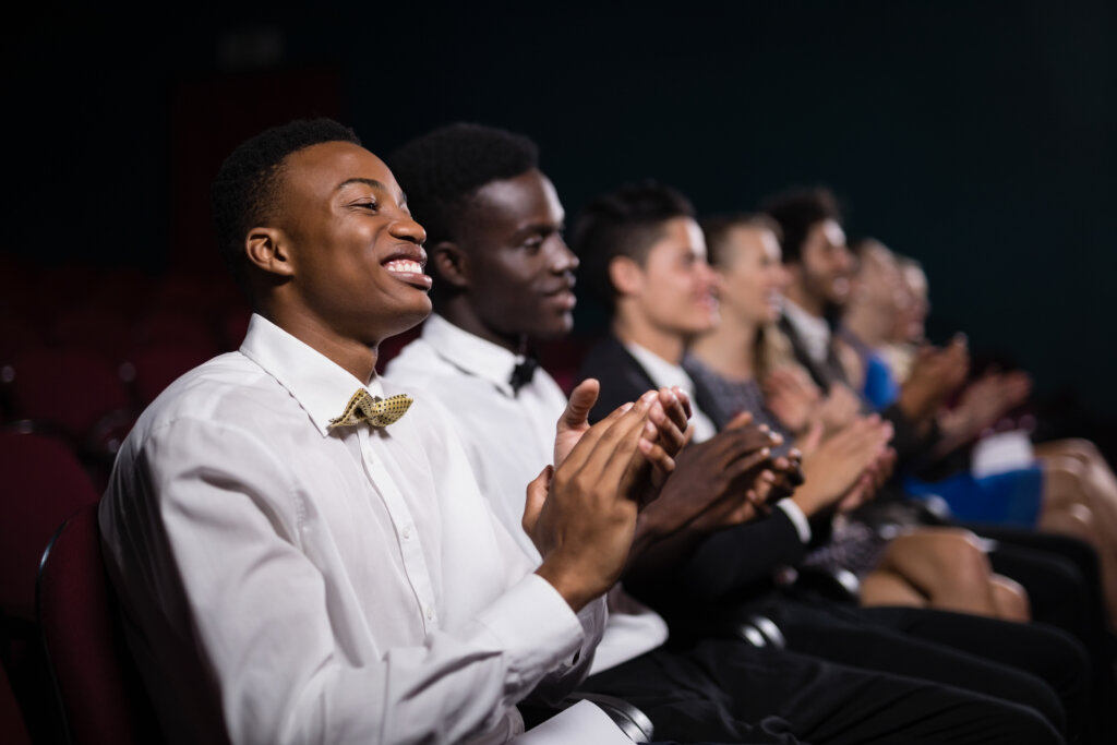 Group of people applauding at an award show