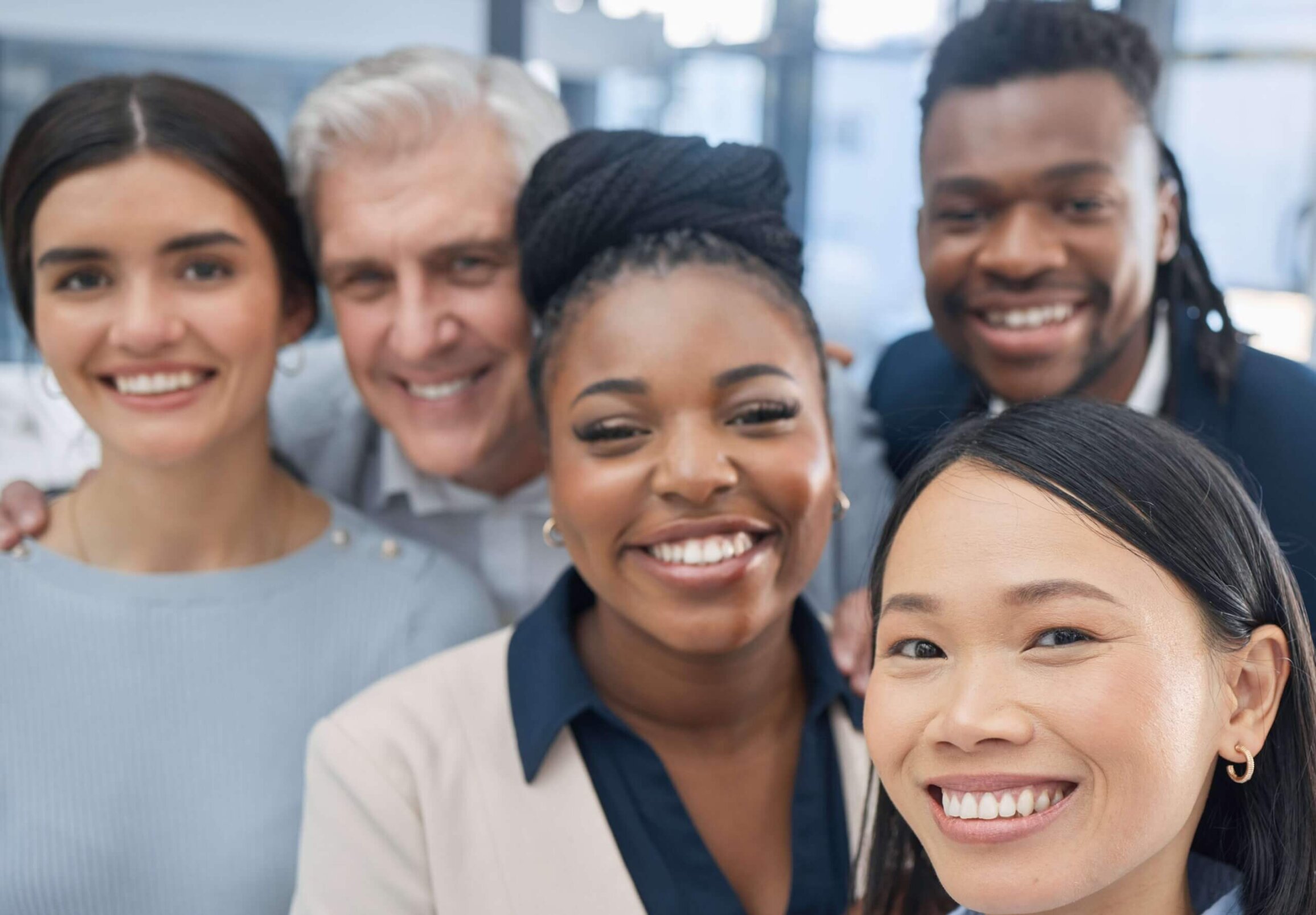 Diverse group selfie shot of happy coworkers