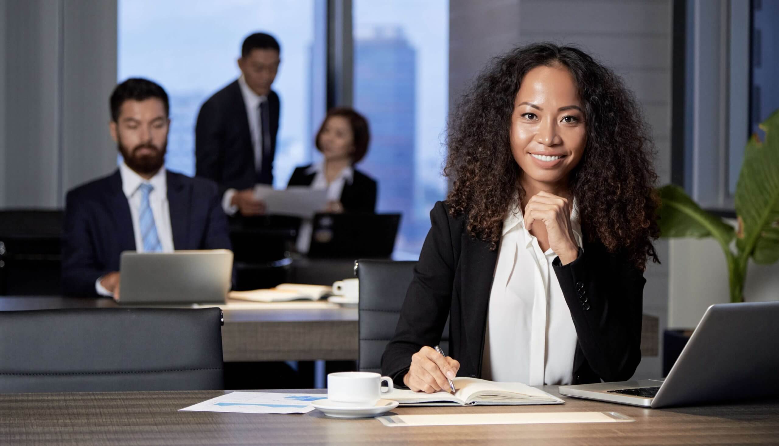 Smiling businesswoman at work in an office