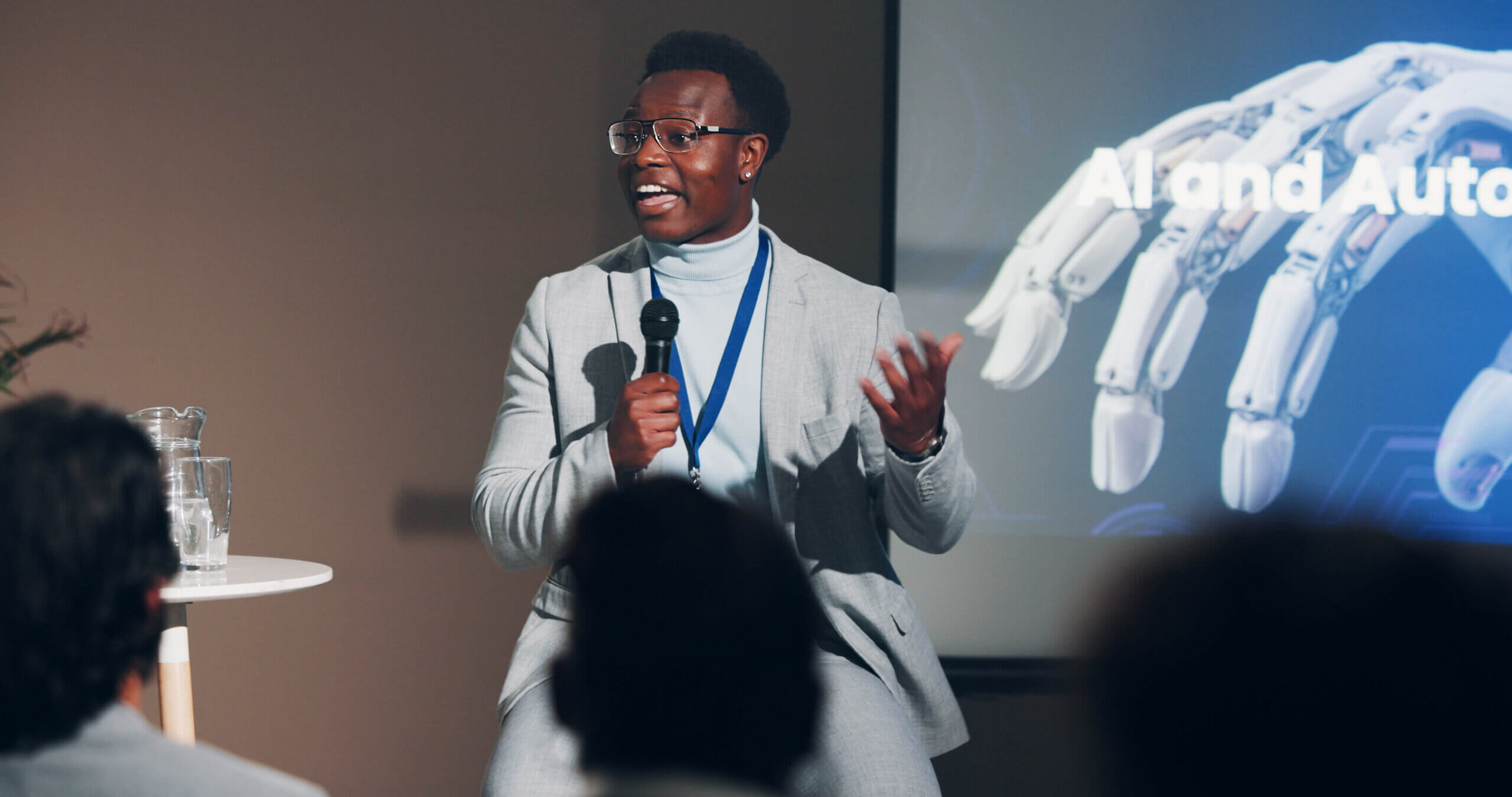Black professional speaking at a conference
