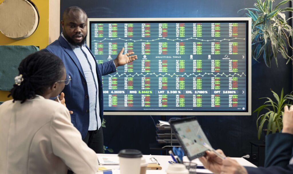 Black man leading a presentation at a conference