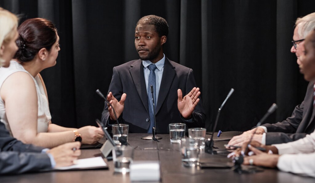 Black businessman conducting a panel interview
